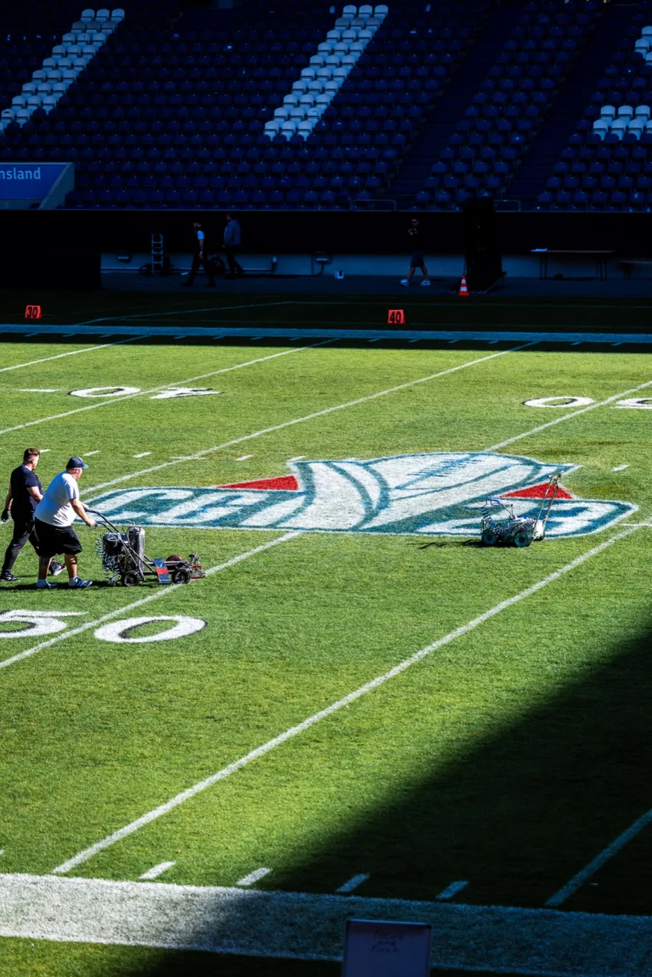 League logo being painted onto the field