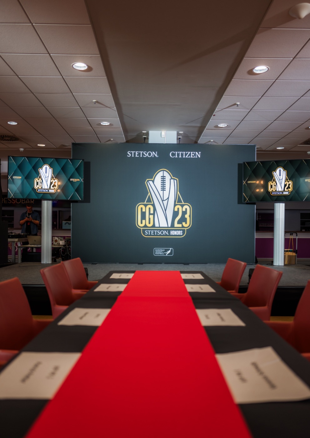 Championship honors event stage with branded screens