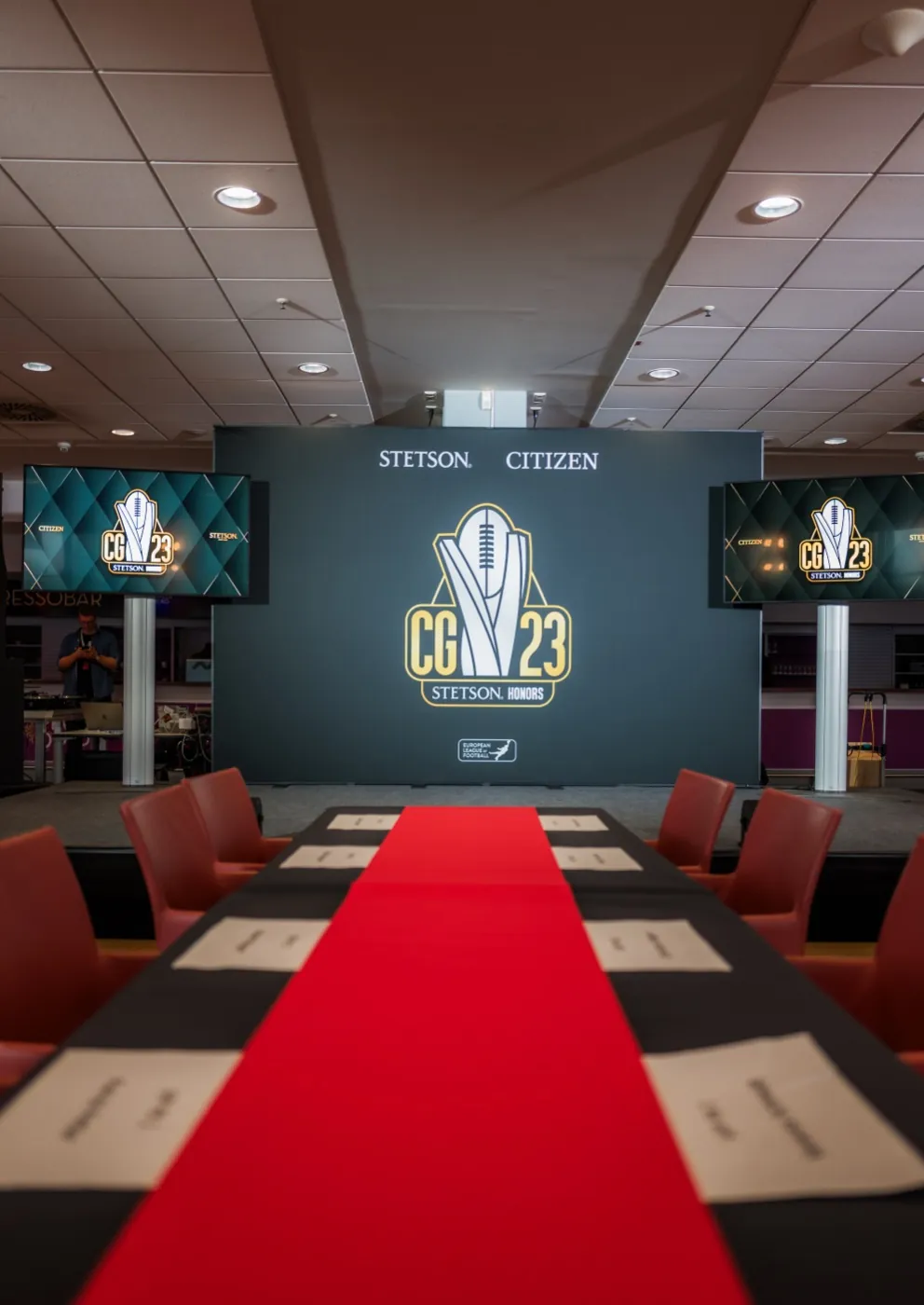 Championship honors event stage with branded screens