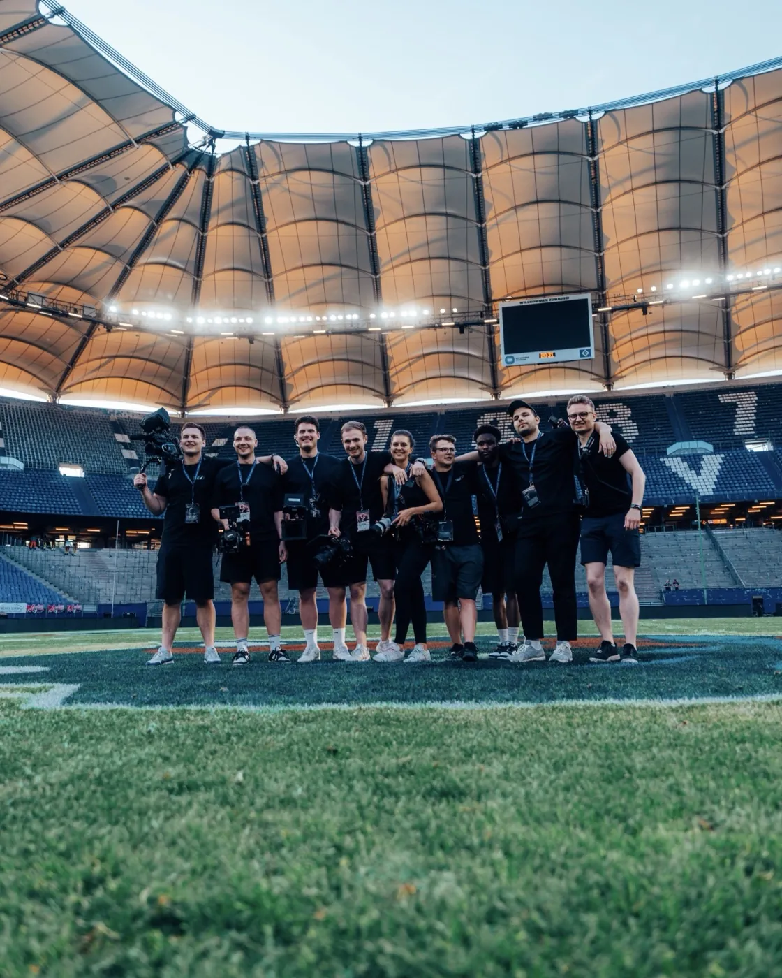 The media team on the field at Volksparkstadion Hamburg